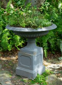 A Pair of Cast Iron Shallow Campana-form Jardinieres on Pedestal Bases