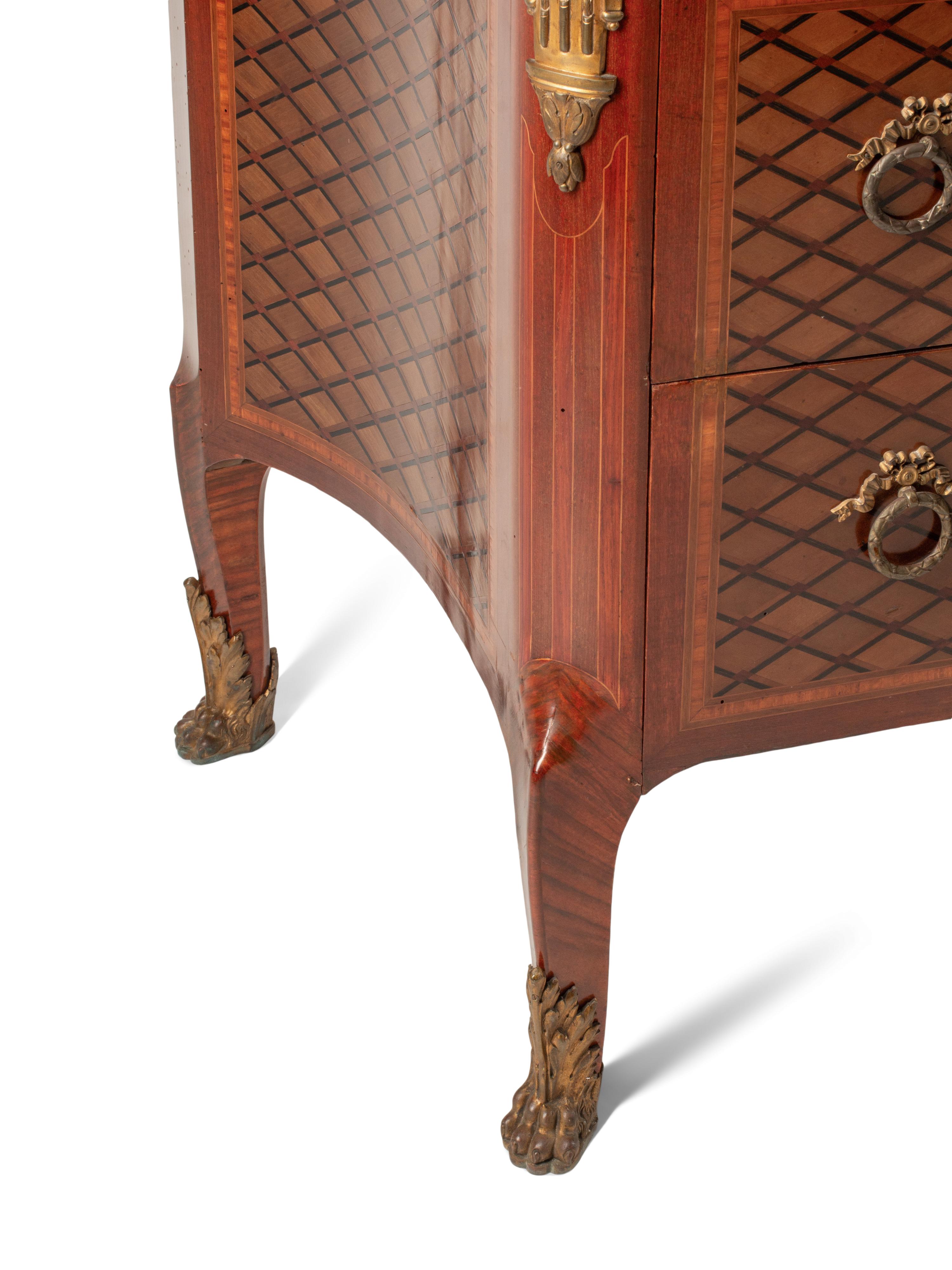 A Louis XVI Style Gilt Bronze Mounted Parquetry and Floral Marquetry Marble-Top Commode