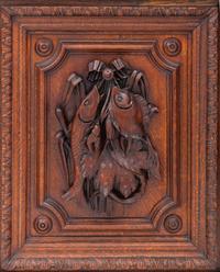 A Swiss Black Forest Carved Hunt Cabinet