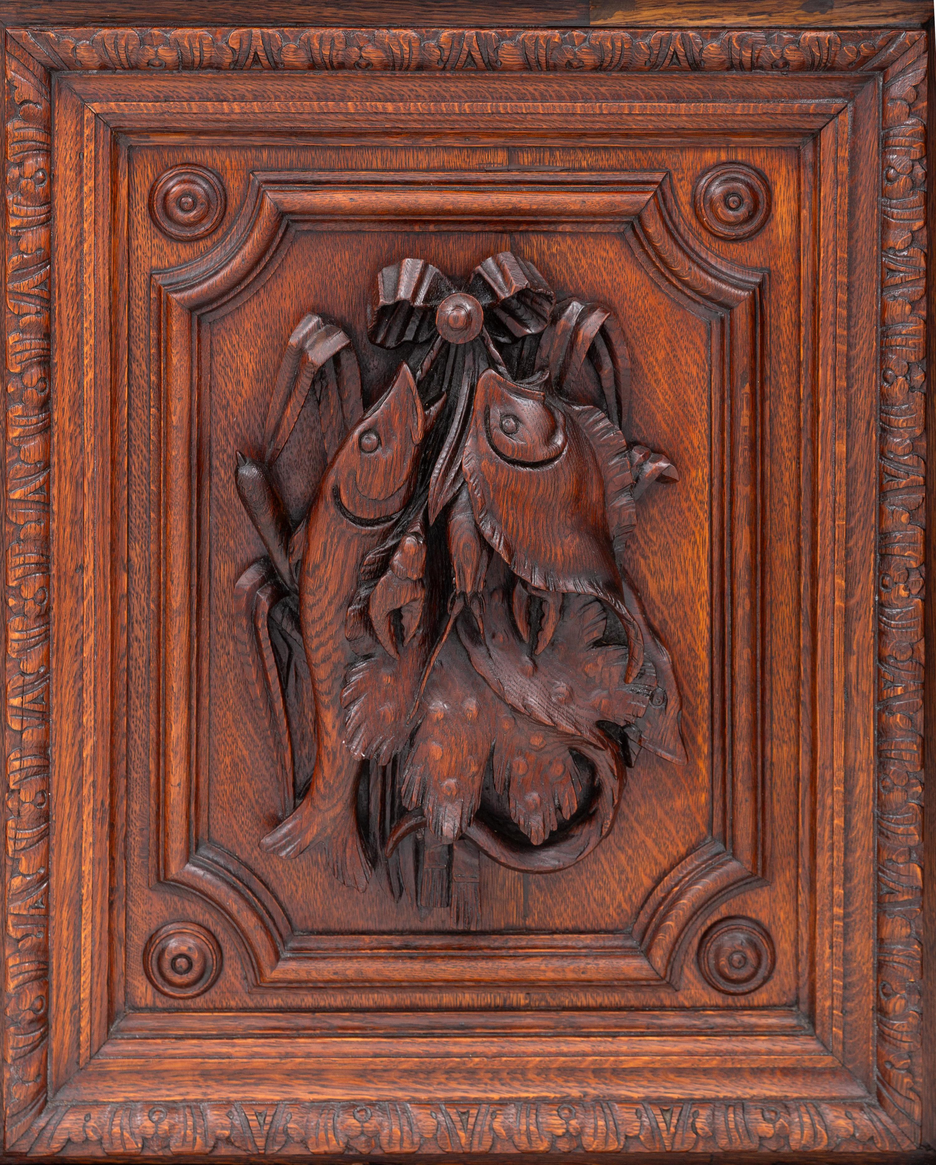 A Swiss Black Forest Carved Hunt Cabinet