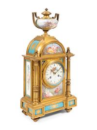 A Louis XVI Style Porcelain Mounted Gilt Bronze Mantel Clock