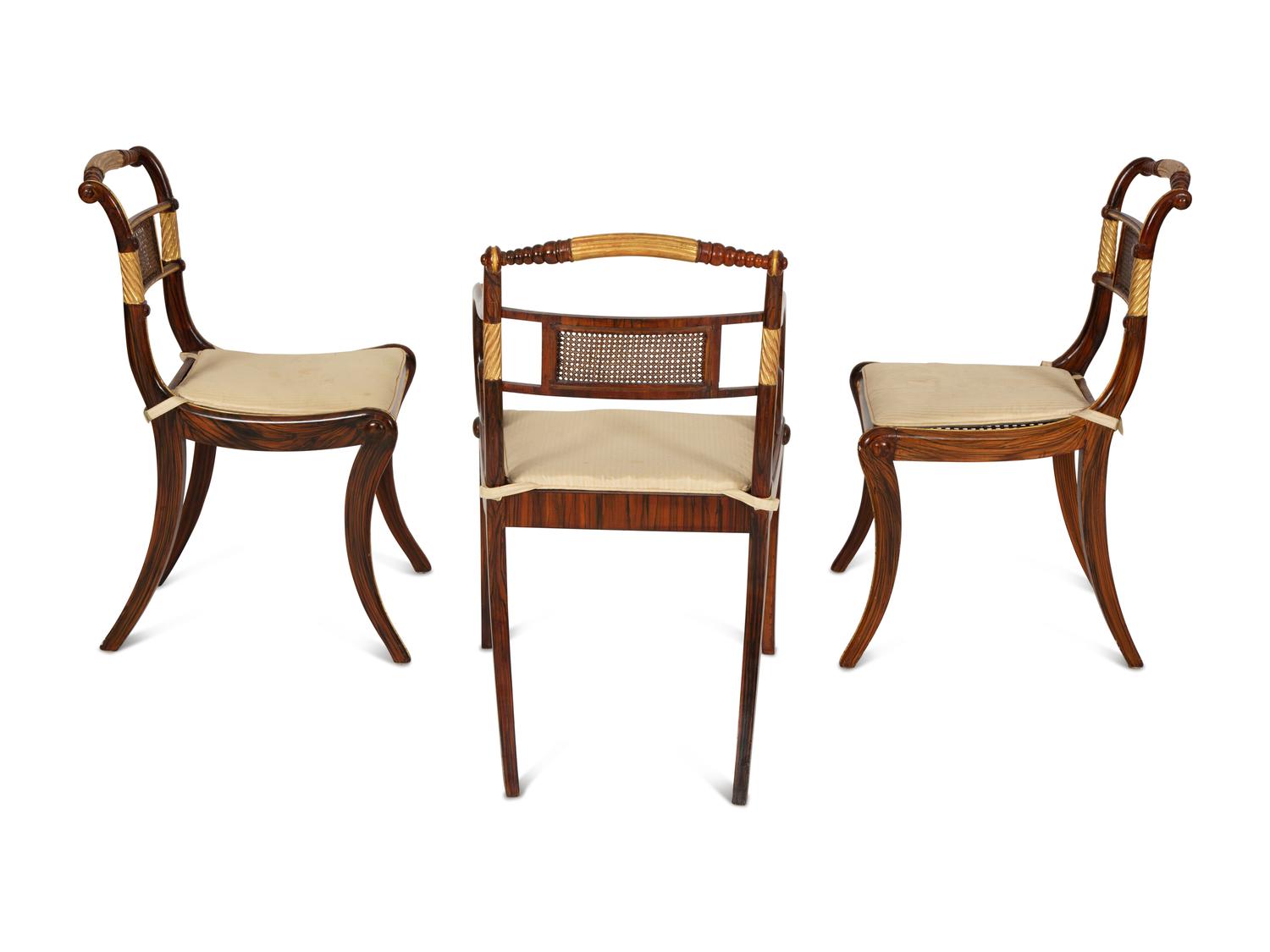A Set of Fourteen Regency and Regency Style Rosewood and Parcel Gilt Dining Chairs