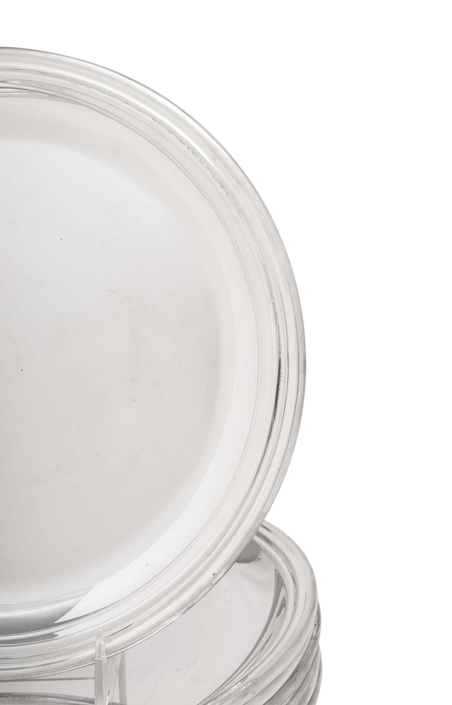 A Set of Eight Puiforcat Silver-Plate Chargers