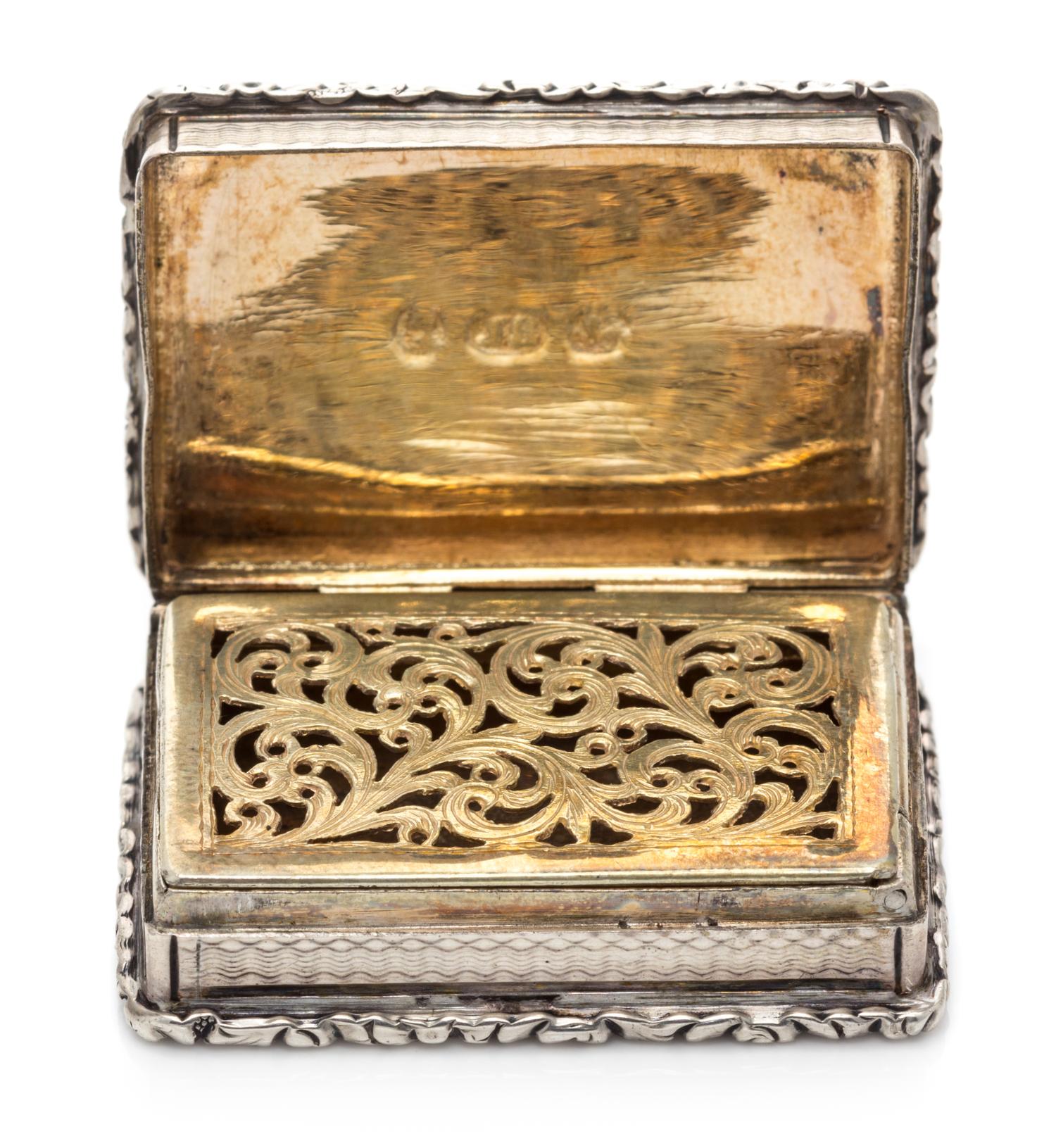 A William IV Silver Vinaigrette, John Bettridge, Birmingham, 1832, the case with an engine turned and volute decorated border.