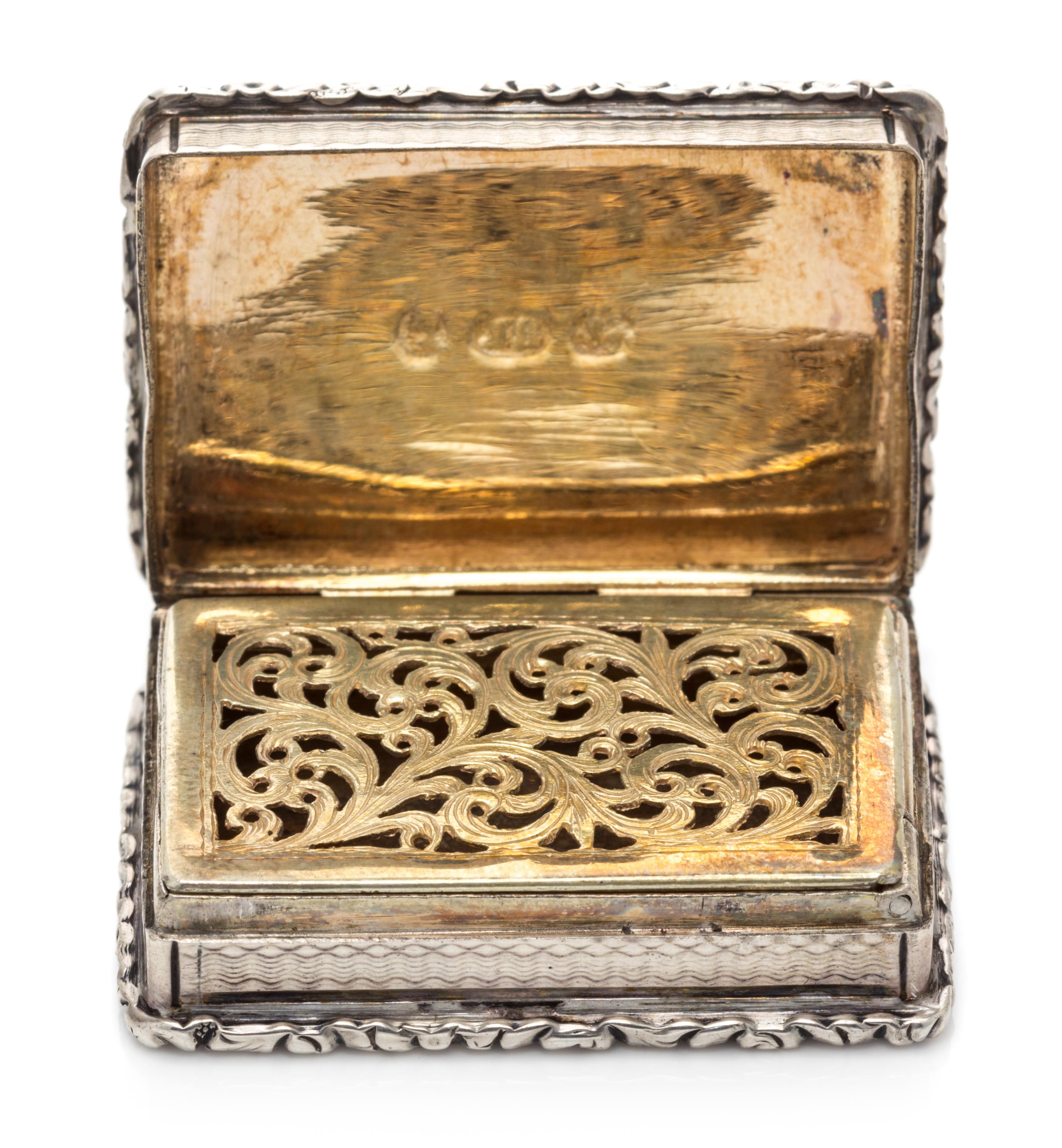 A William IV Silver Vinaigrette, John Bettridge, Birmingham, 1832, the case with an engine turned and volute decorated border.