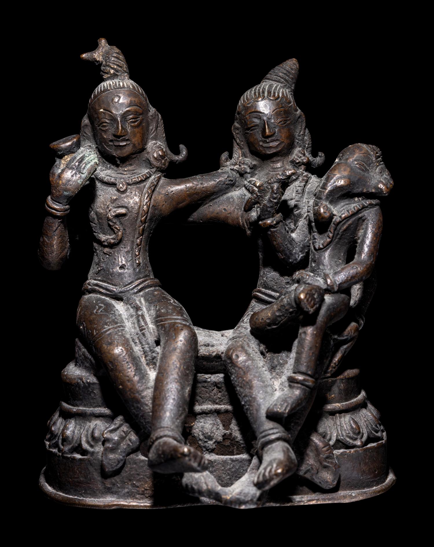 An Indian Bronze Group of Shiva and Parvati with Ganesha