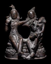 An Indian Bronze Group of Shiva and Parvati with Ganesha