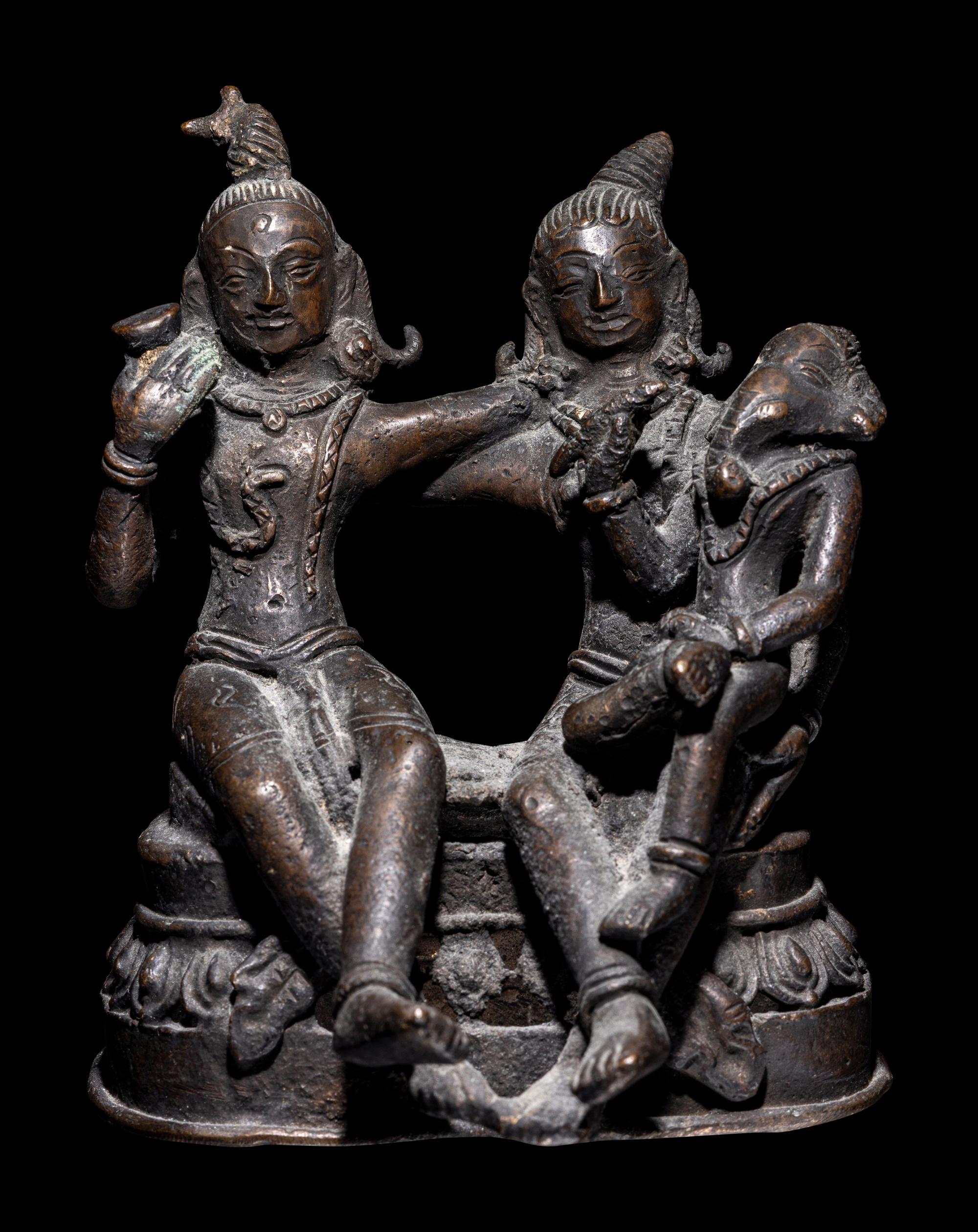 An Indian Bronze Group of Shiva and Parvati with Ganesha