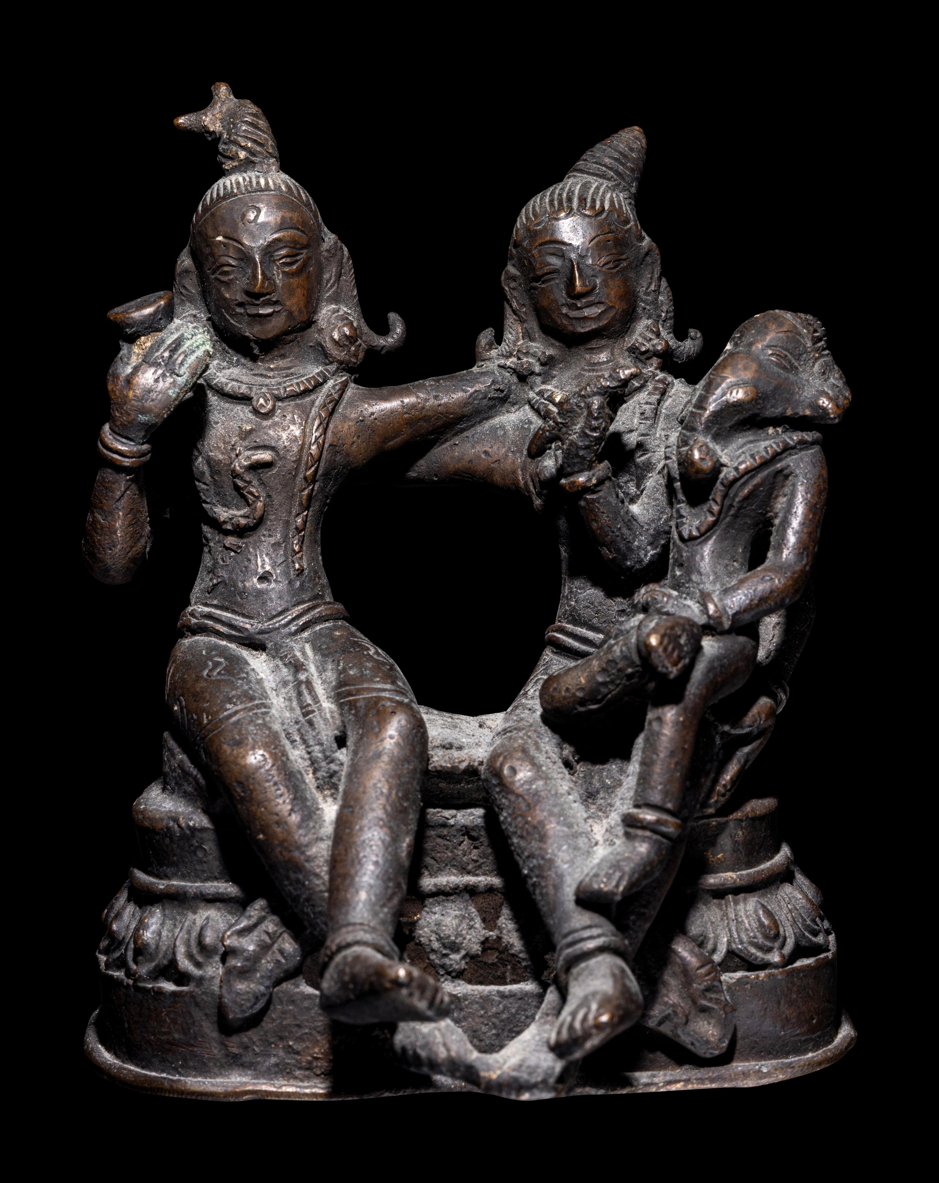 An Indian Bronze Group of Shiva and Parvati with Ganesha