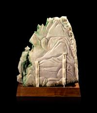 A Chinese Export Carved Jadeite Model of Buddha Within a Mountain