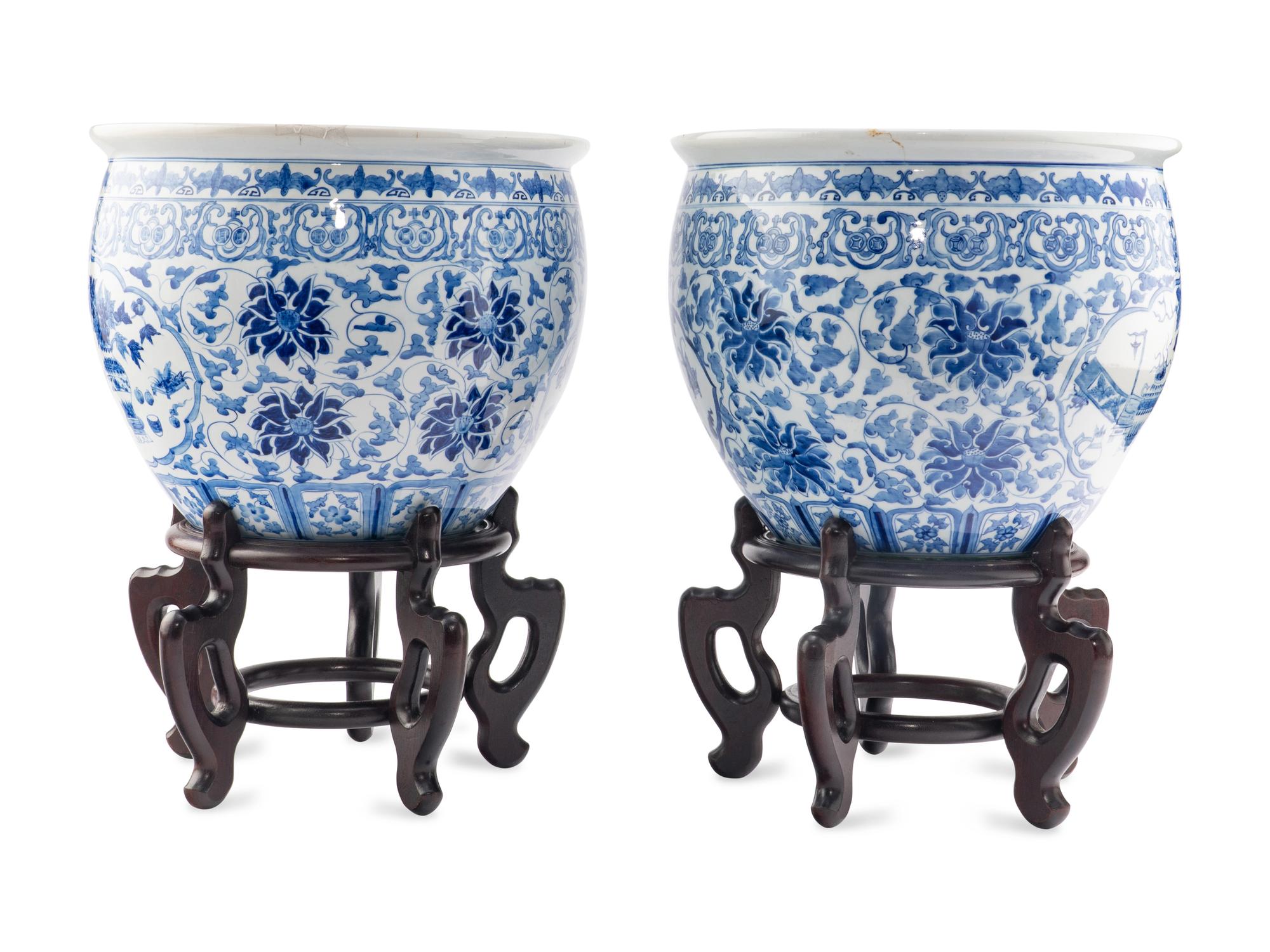 A Pair of Blue and White Porcelain Jardinieres with Wood Stands