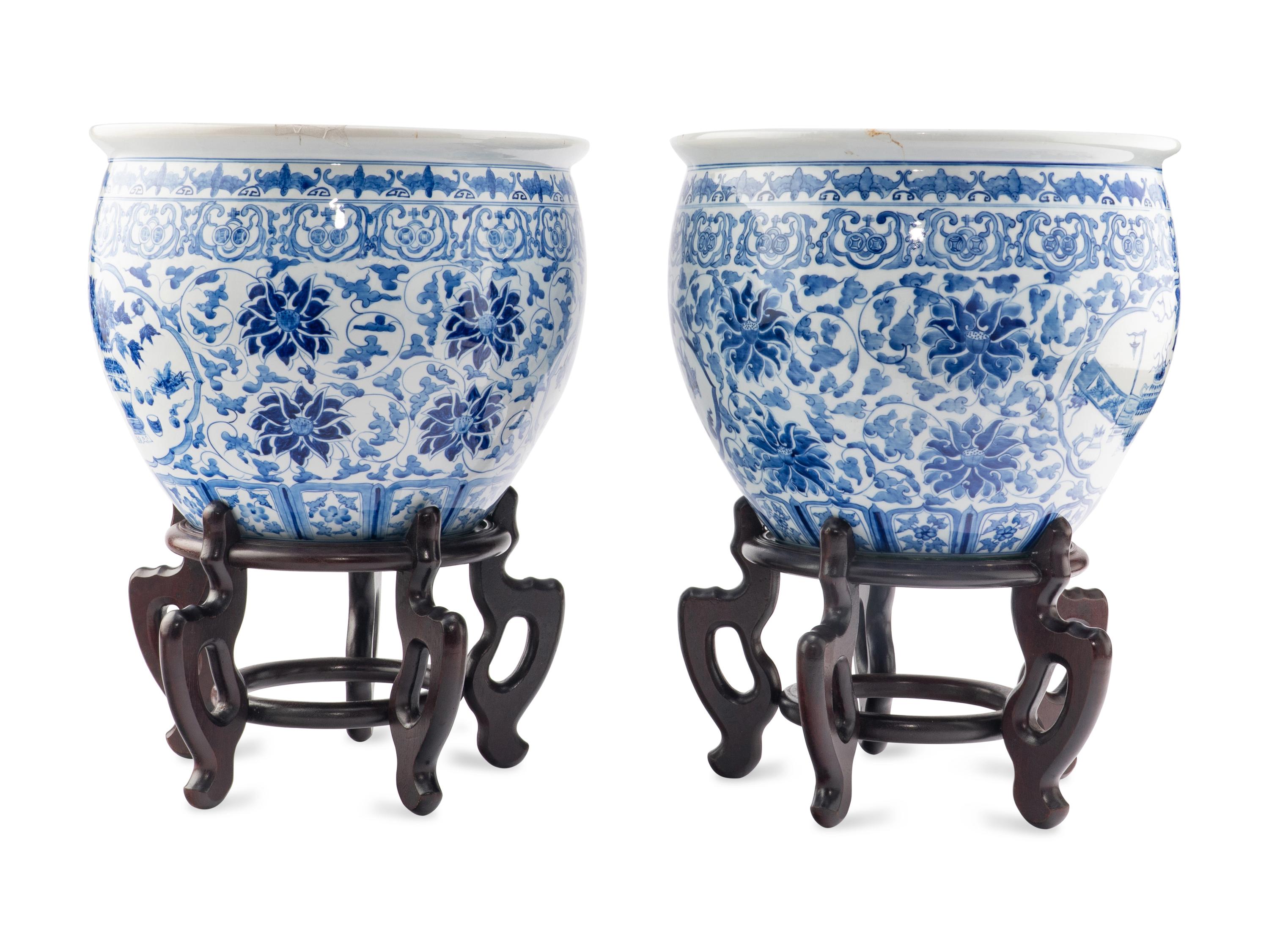 A Pair of Blue and White Porcelain Jardinieres with Wood Stands
