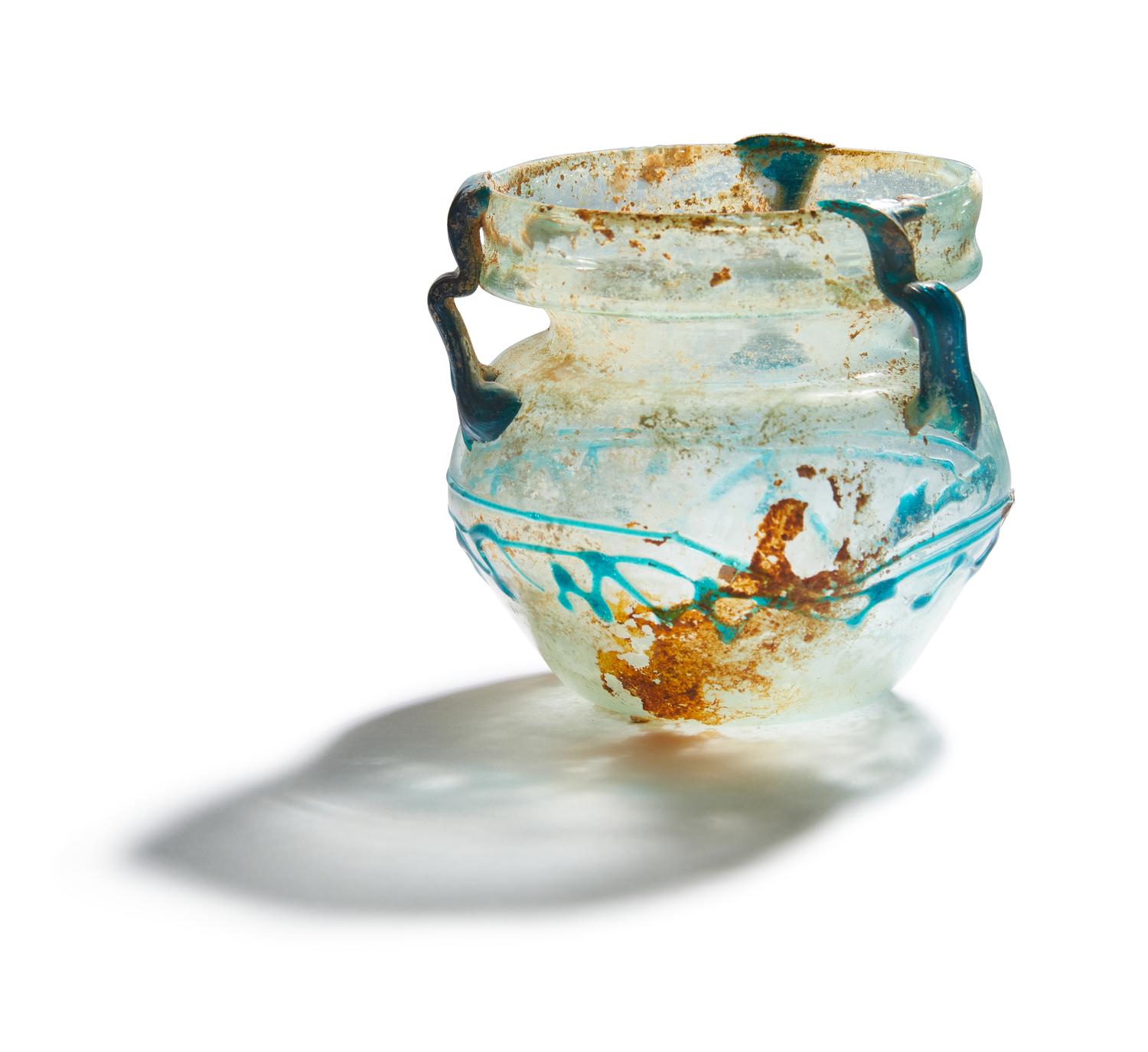A Roman Pale Blue Glass Jar with Blue Spiral Trail