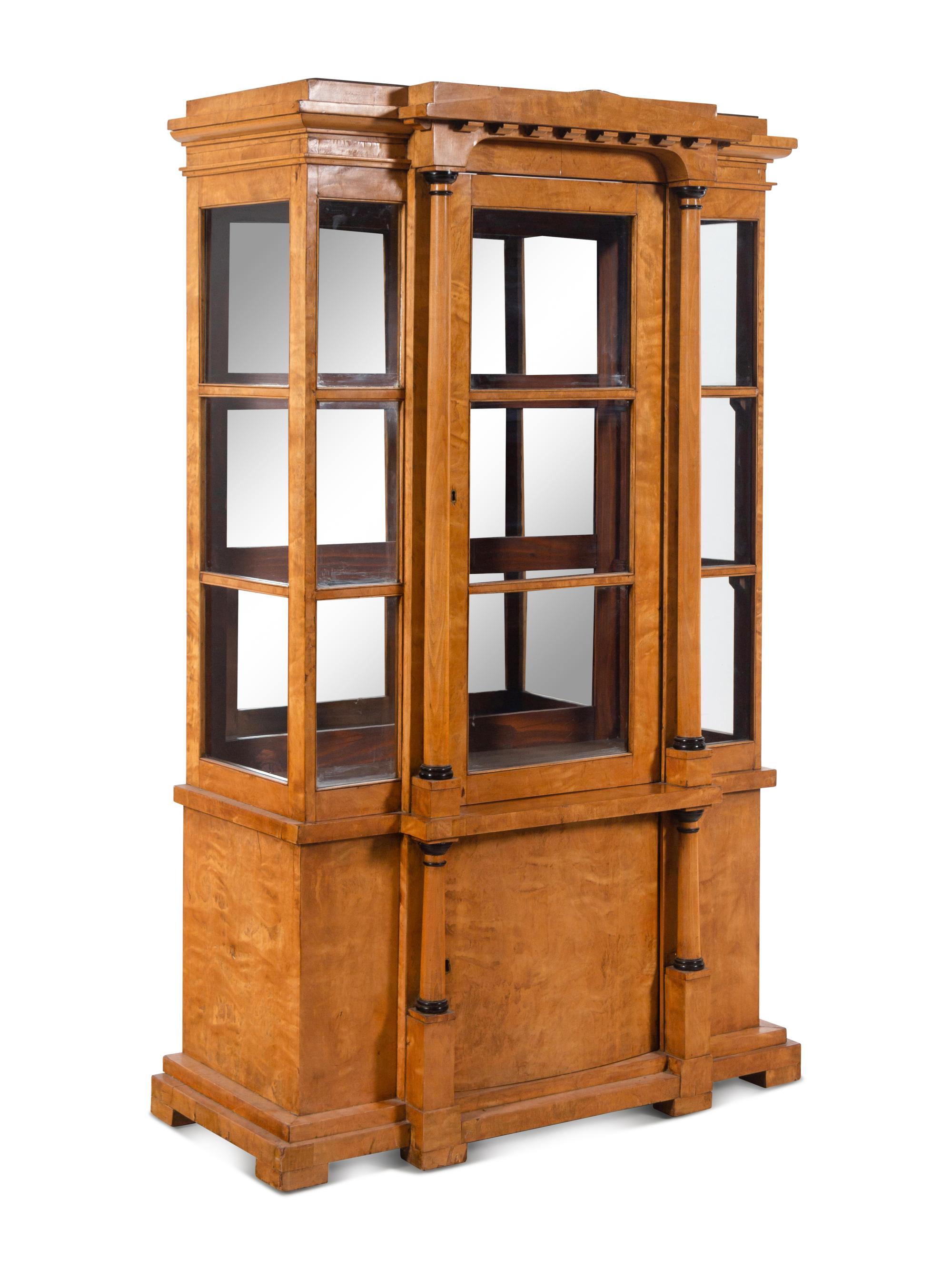 A German or Austrian Neoclassical Parcel Ebonized Birch Breakfront Vitrine Cabinet