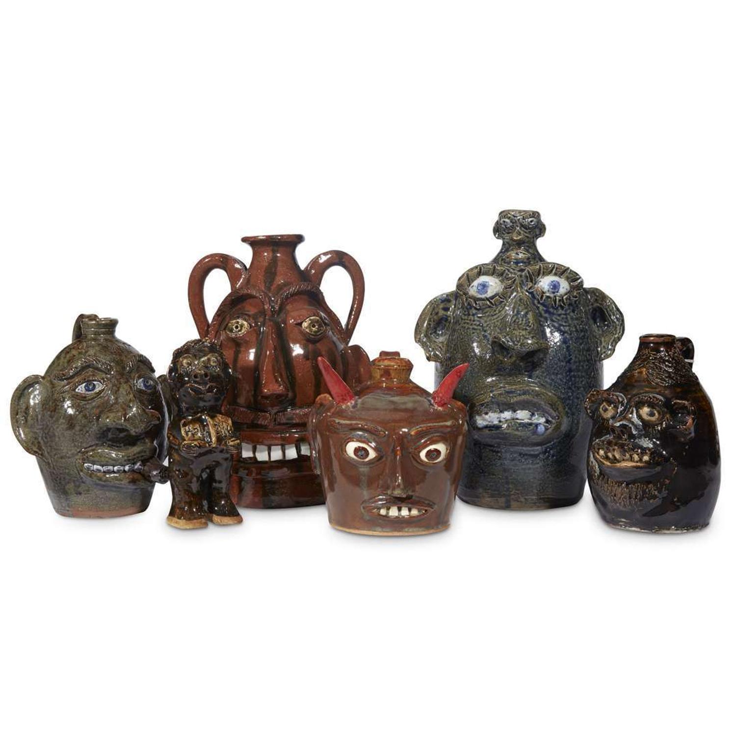 Group of five glazed stoneware face jugs and one figure various artists, Southern States, late 20th century