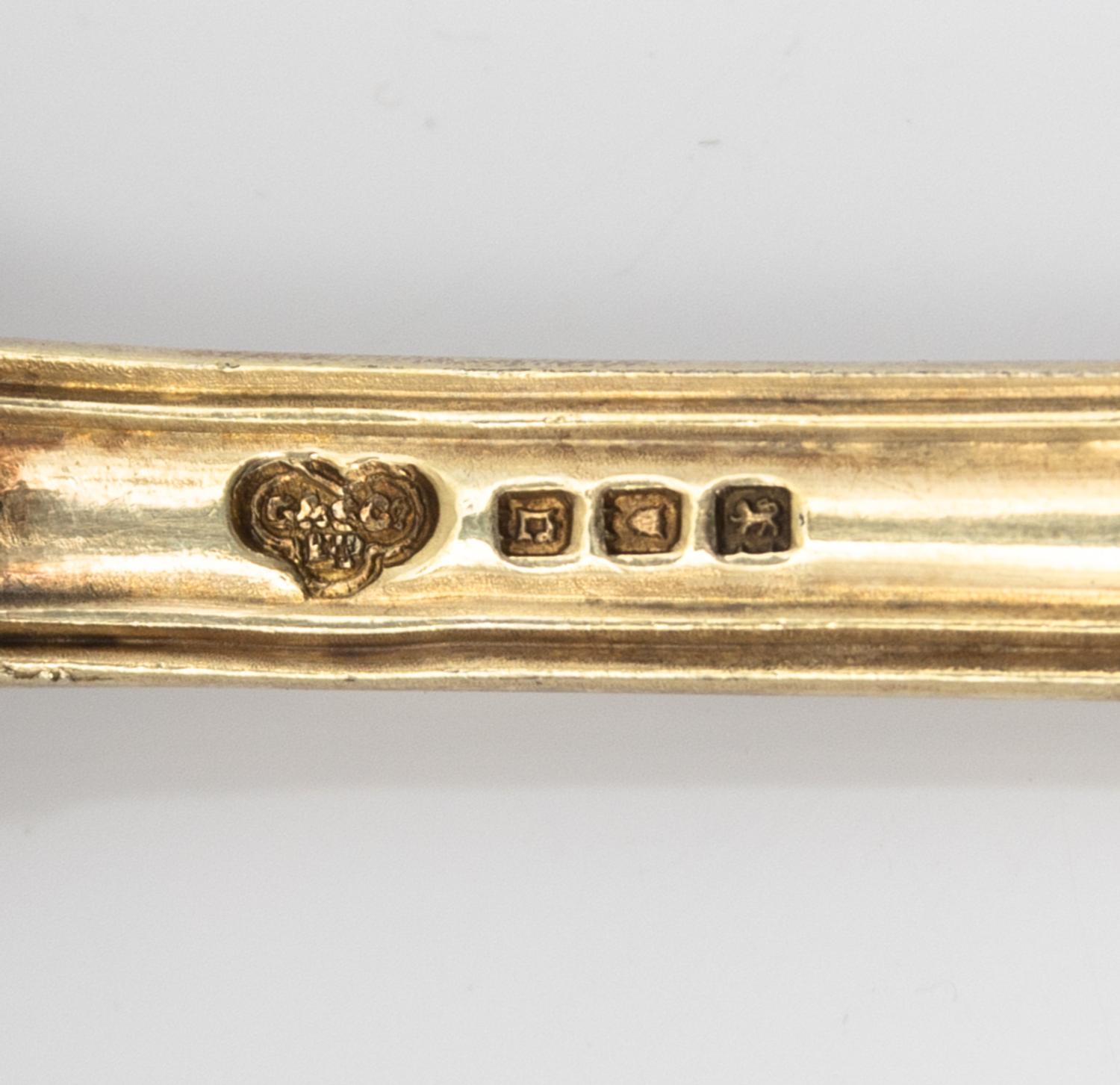 A Set of Four English Silver-Gilt Dessert Spoons