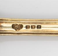 A Set of Four English Silver-Gilt Dessert Spoons
