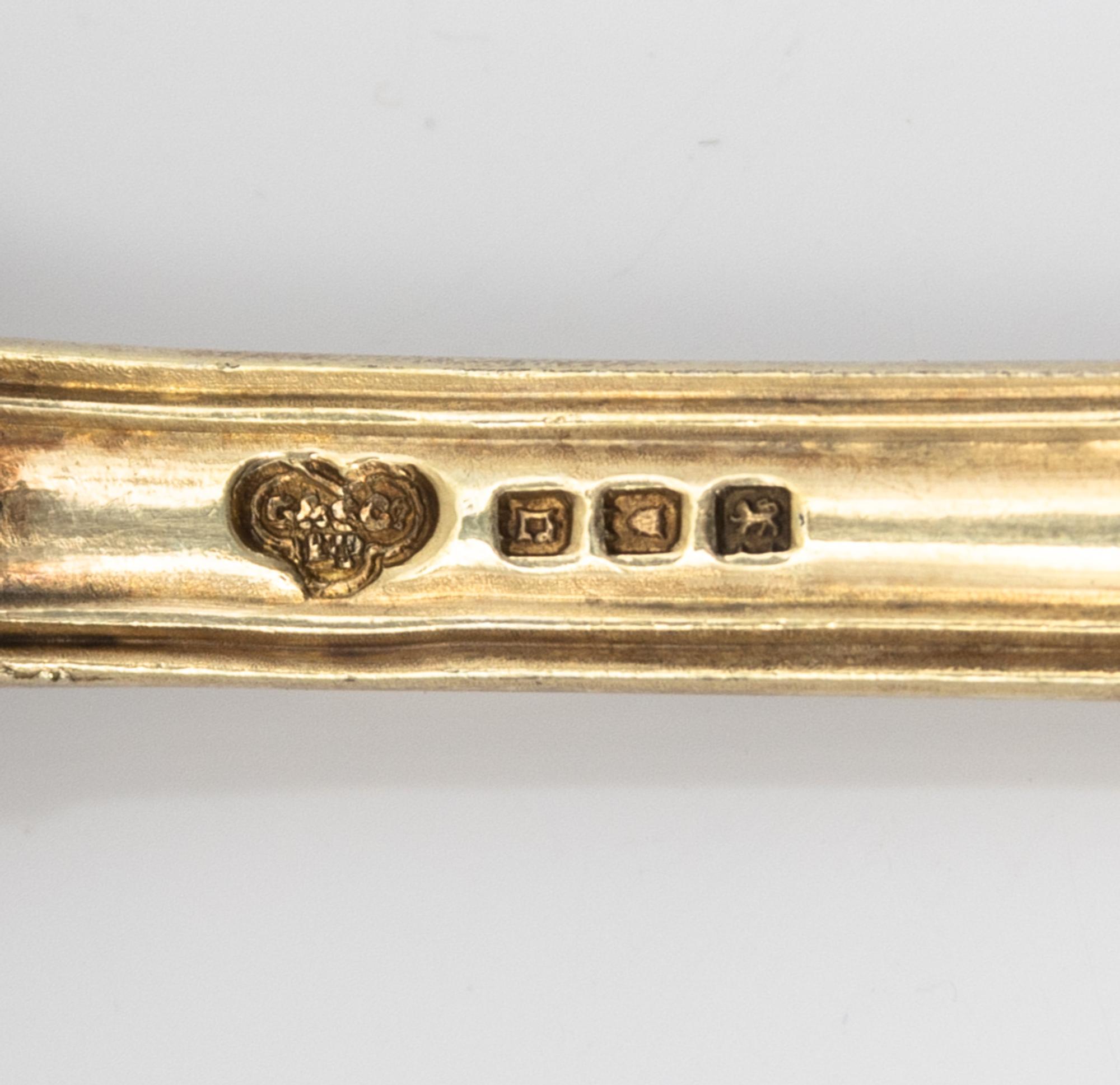 A Set of Four English Silver-Gilt Dessert Spoons