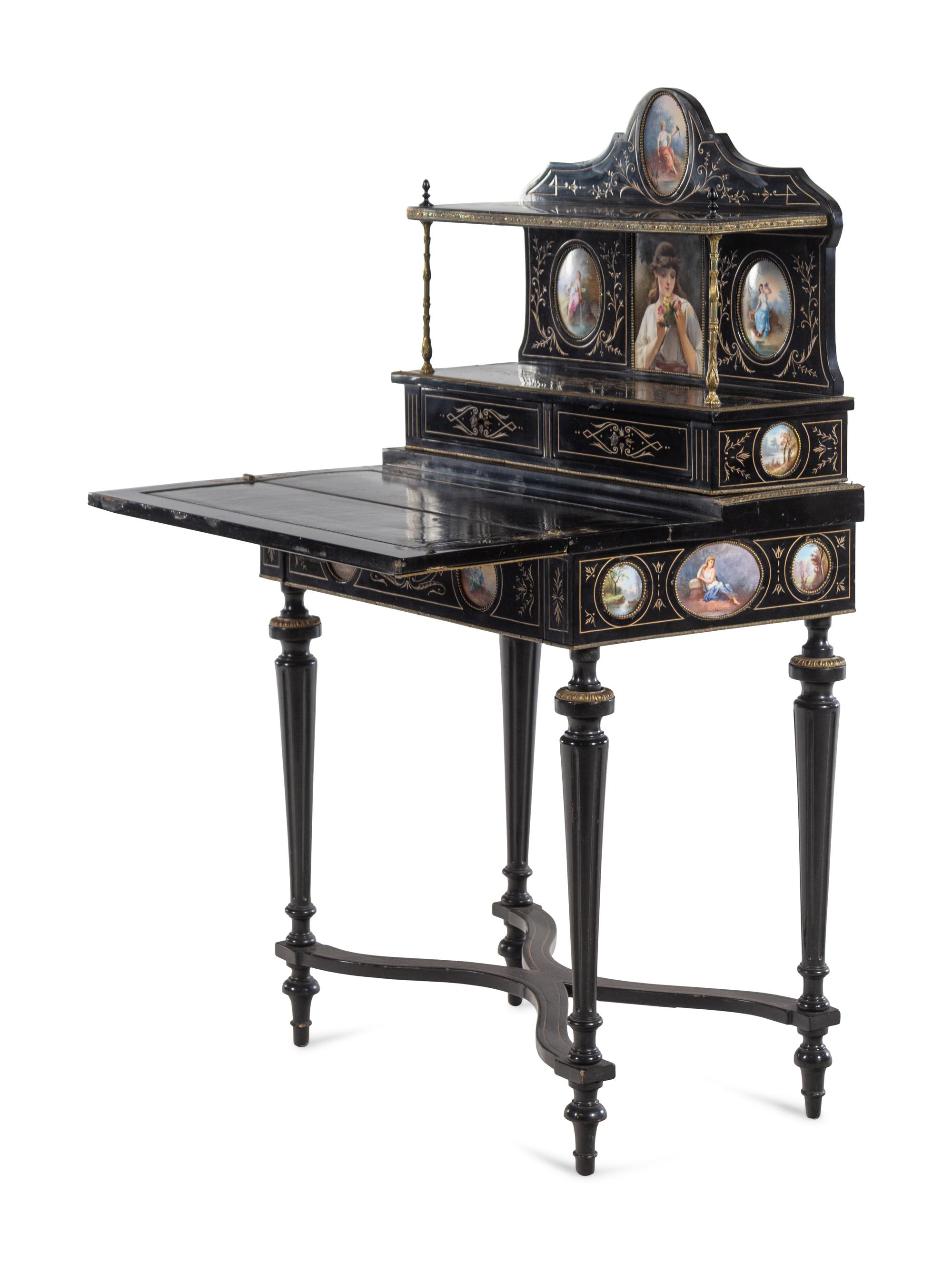 A Napoleon III Porcelain Mounted Ebonized Bonheur du Jour