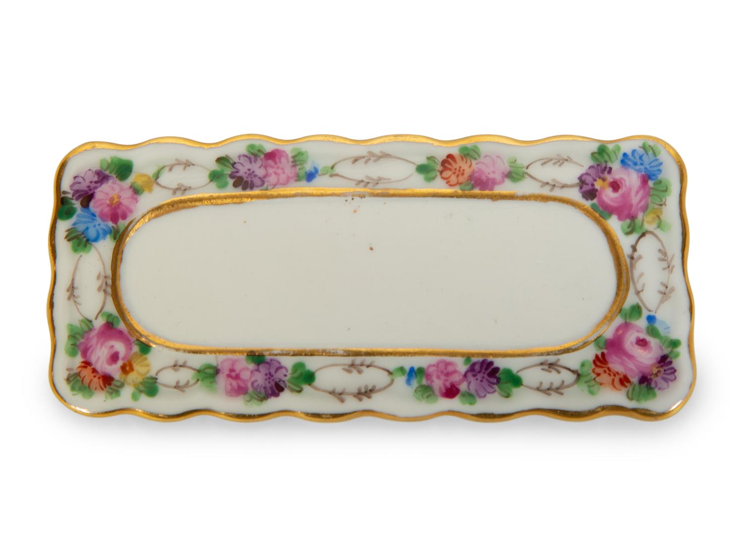 A Collection of Dresden Porcelain Place Cards, Holders and Napkin Rings
