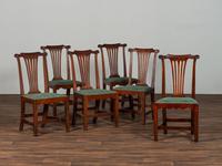 A Set of Six Chippendale Volute-Carved Mahogany Side Chairs