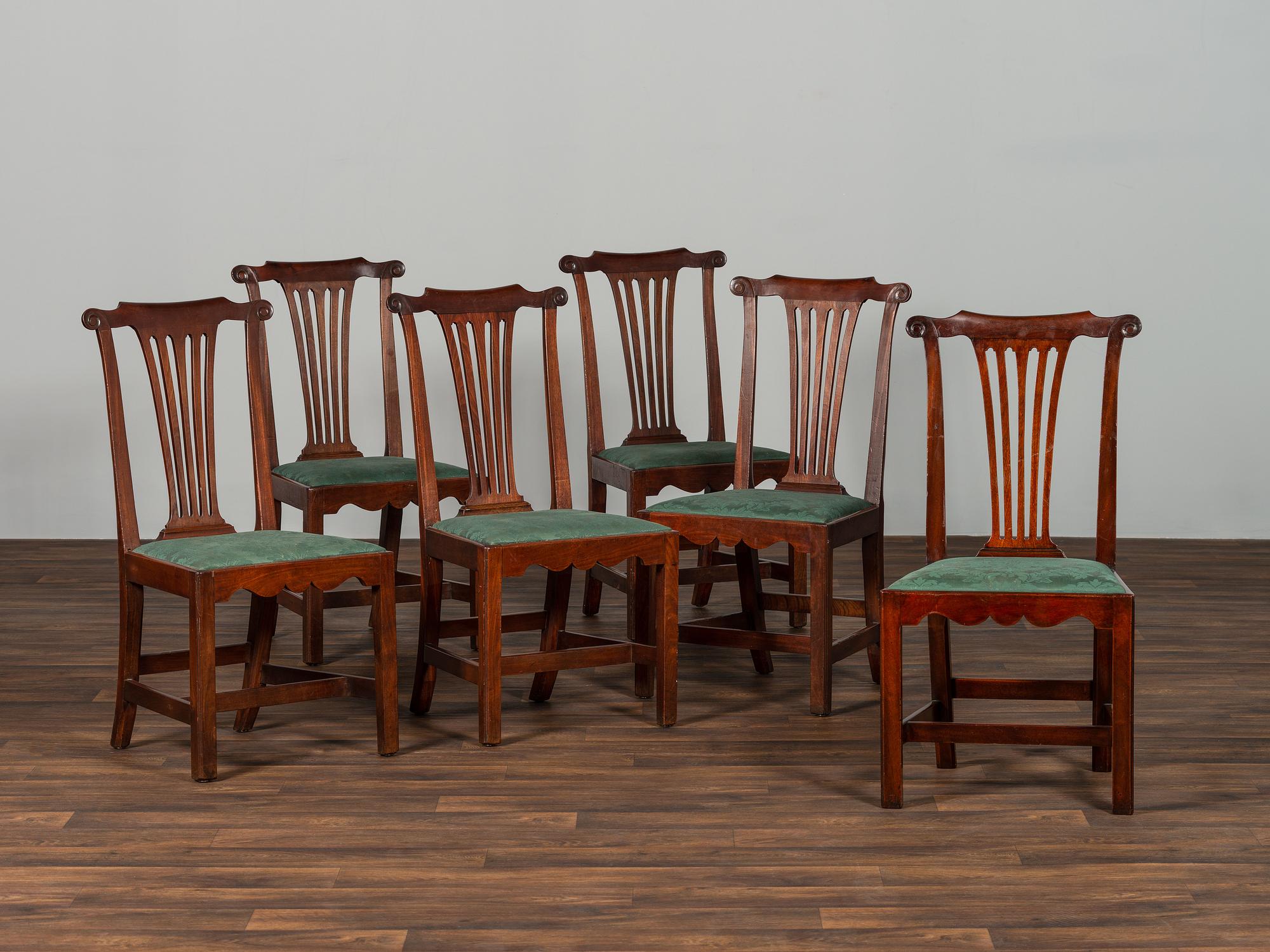 A Set of Six Chippendale Volute-Carved Mahogany Side Chairs