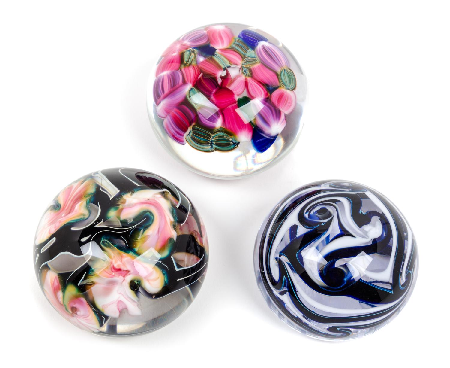Three American Studio Glass Paperweights Diameter of largest 3 inches.