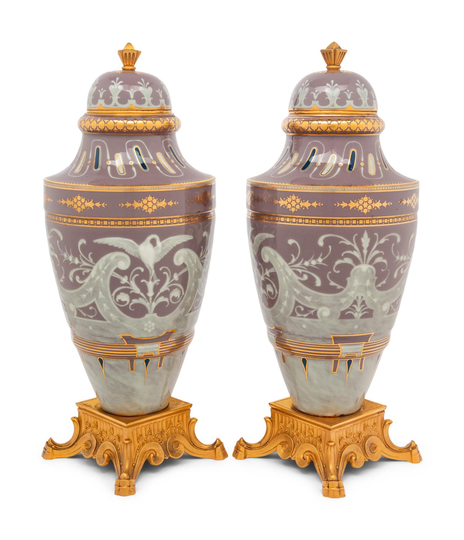 A Pair of Continental Pâte-sur-Pâte Porcelain and Gilt-Bronze Mounted Covered Urns