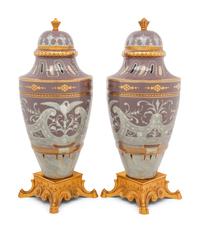 A Pair of Continental Pâte-sur-Pâte Porcelain and Gilt-Bronze Mounted Covered Urns