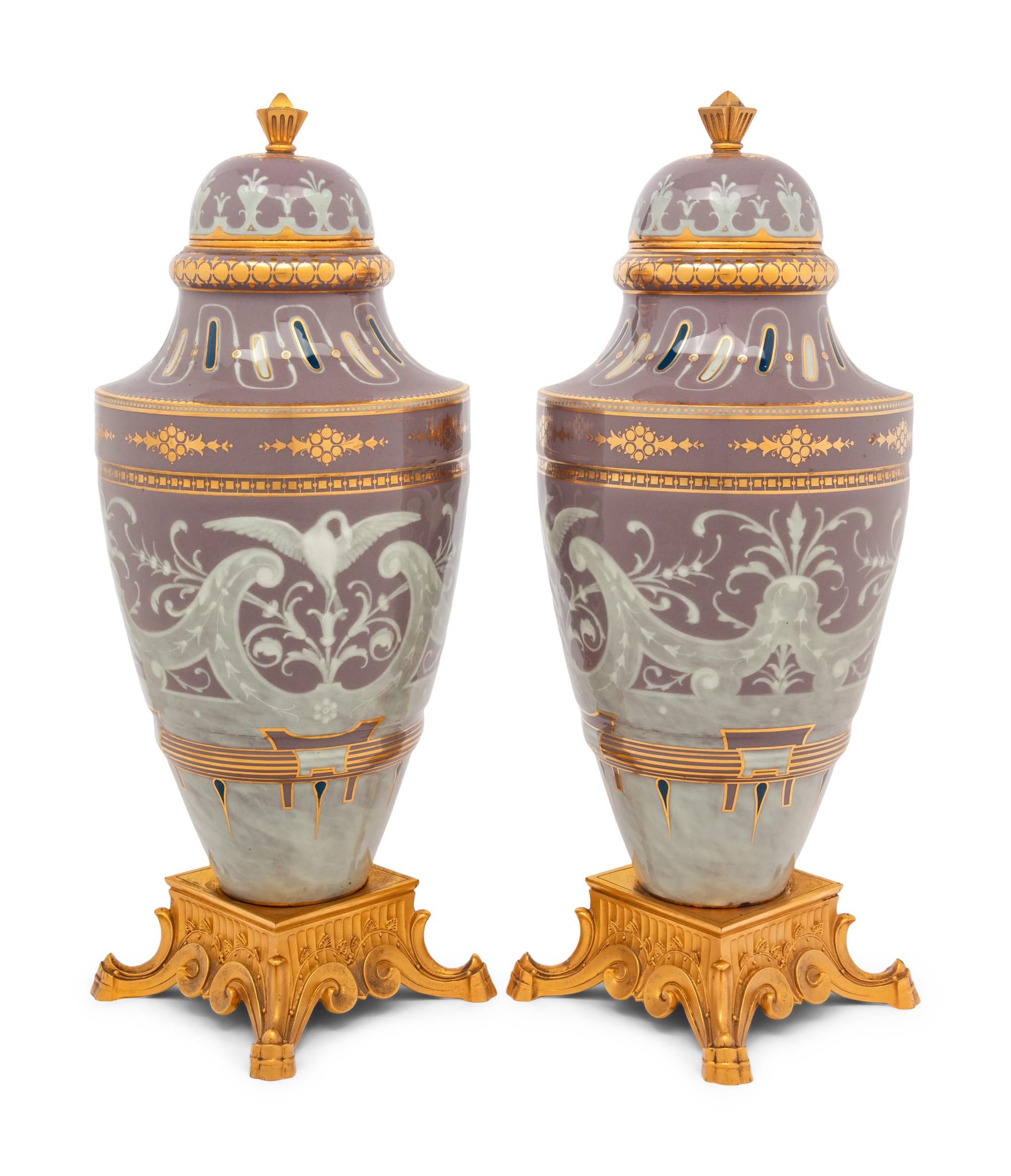 A Pair of Continental Pâte-sur-Pâte Porcelain and Gilt-Bronze Mounted Covered Urns