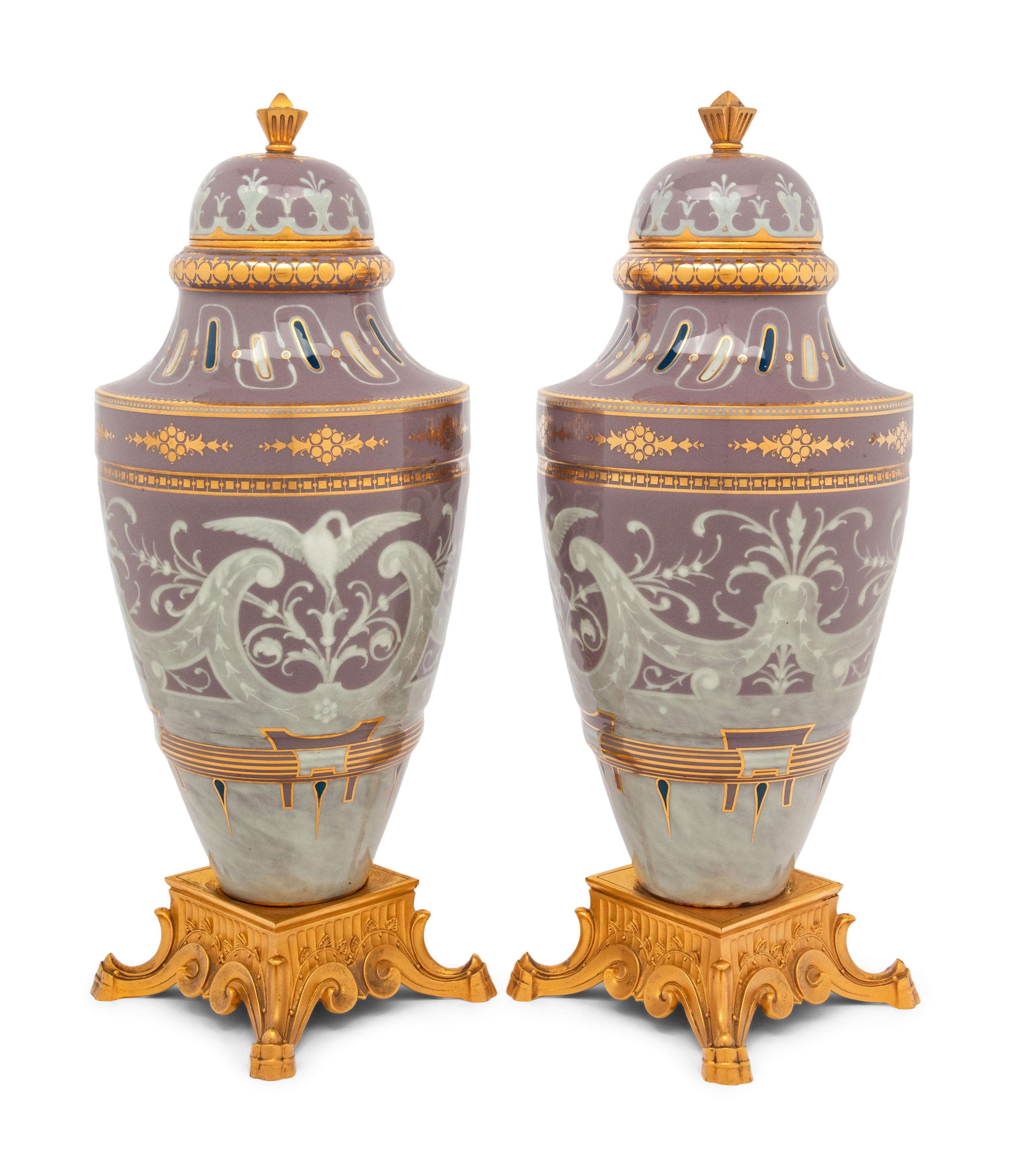 A Pair of Continental Pâte-sur-Pâte Porcelain and Gilt-Bronze Mounted Covered Urns