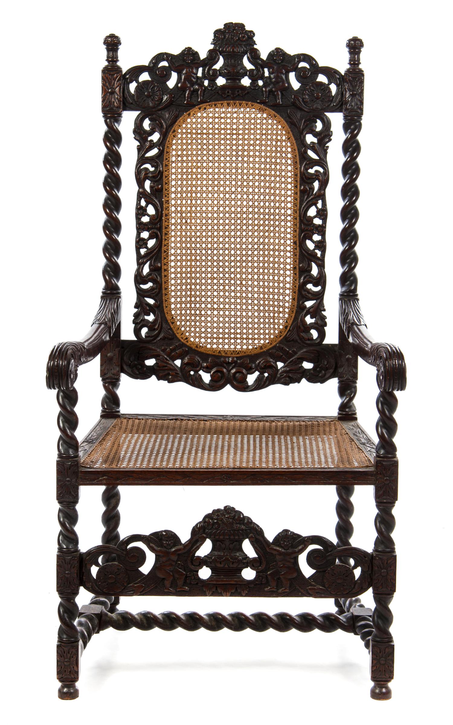 A Henry II Style Walnut Cane Upholstered Armchair Height 48 x width 25 x depth 19 1/8 inches.
