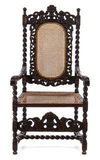A Henry II Style Walnut Cane Upholstered Armchair Height 48 x width 25 x depth 19 1/8 inches.