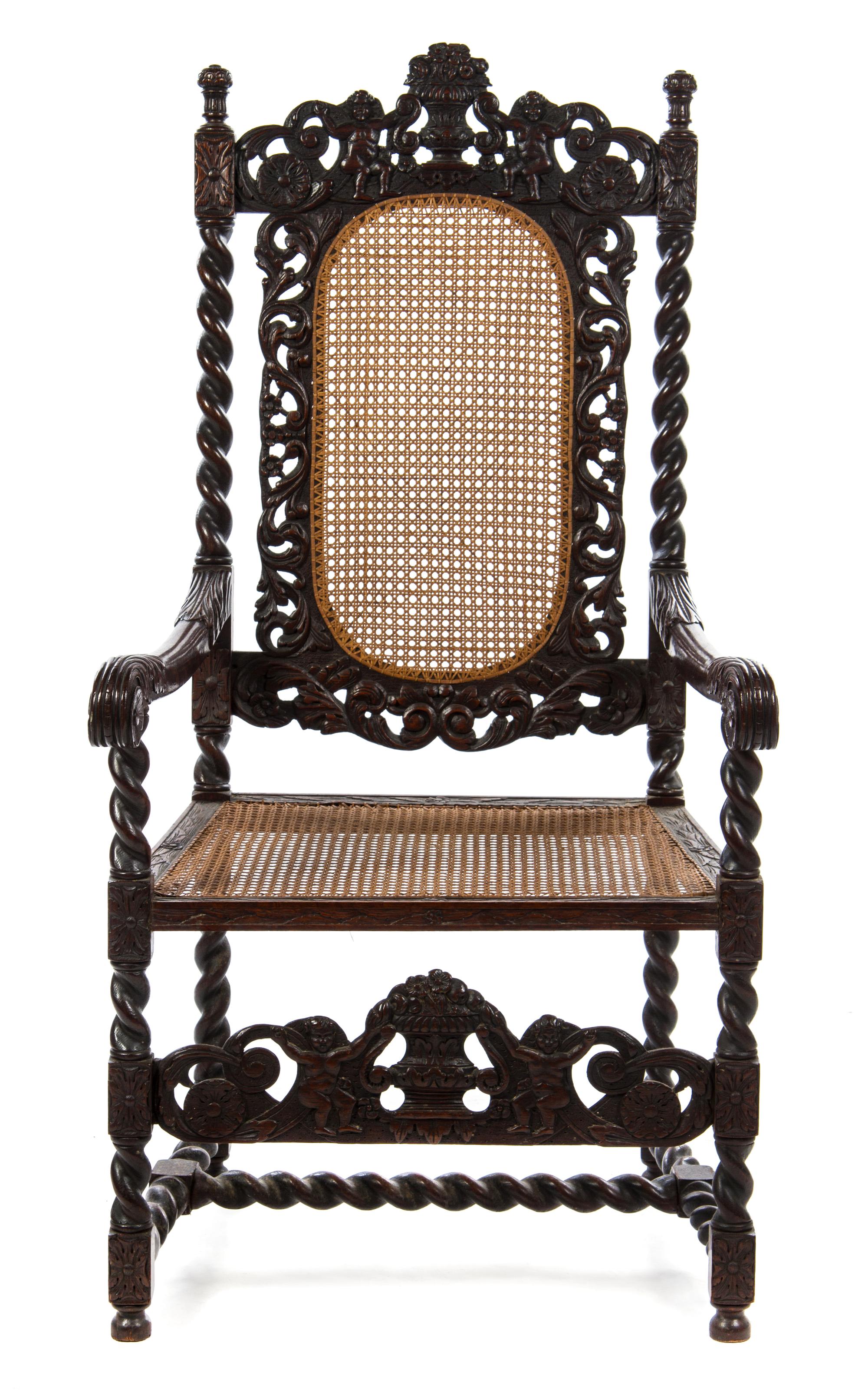 A Henry II Style Walnut Cane Upholstered Armchair Height 48 x width 25 x depth 19 1/8 inches.