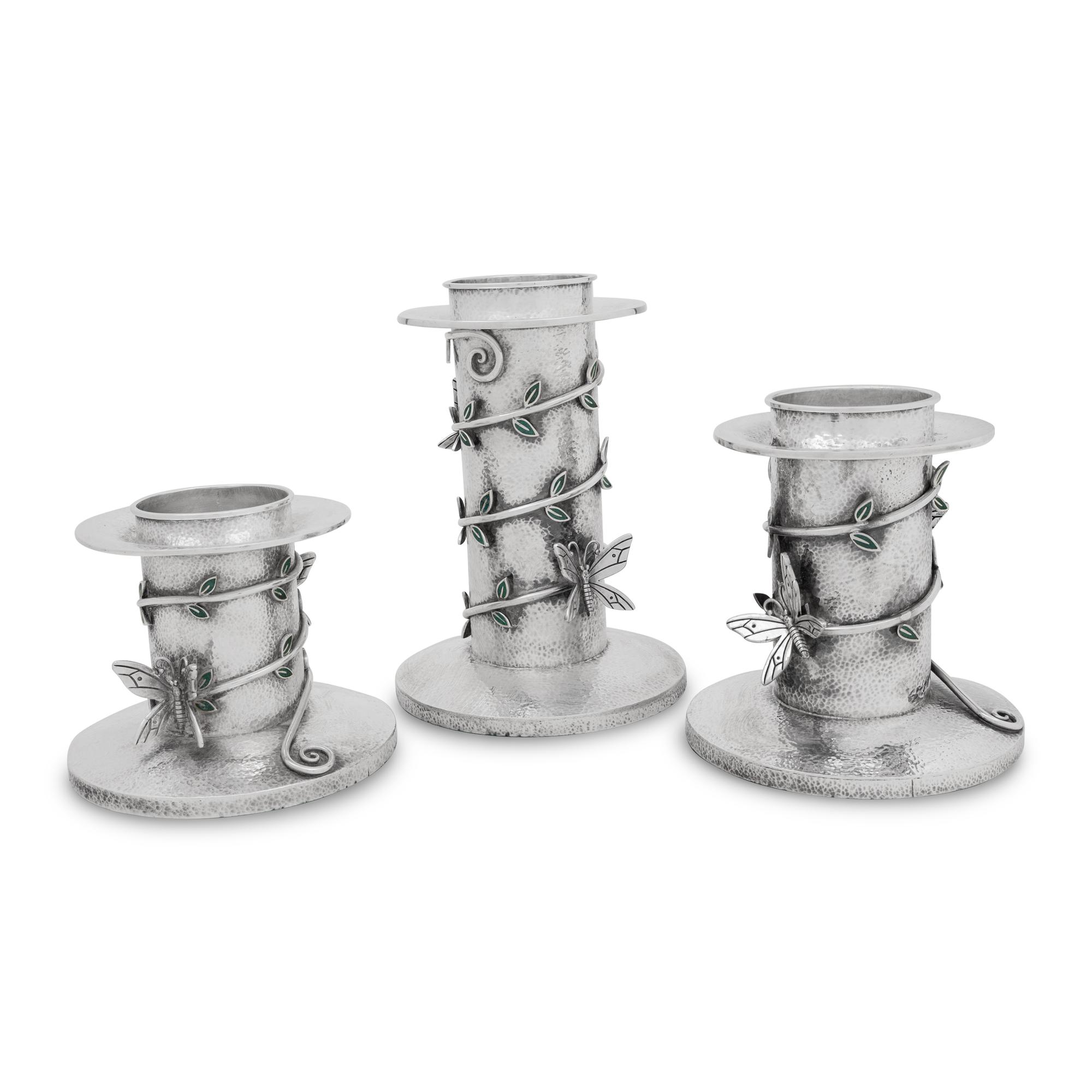 A Set of Three Mexican Silver Graduated Candlesticks