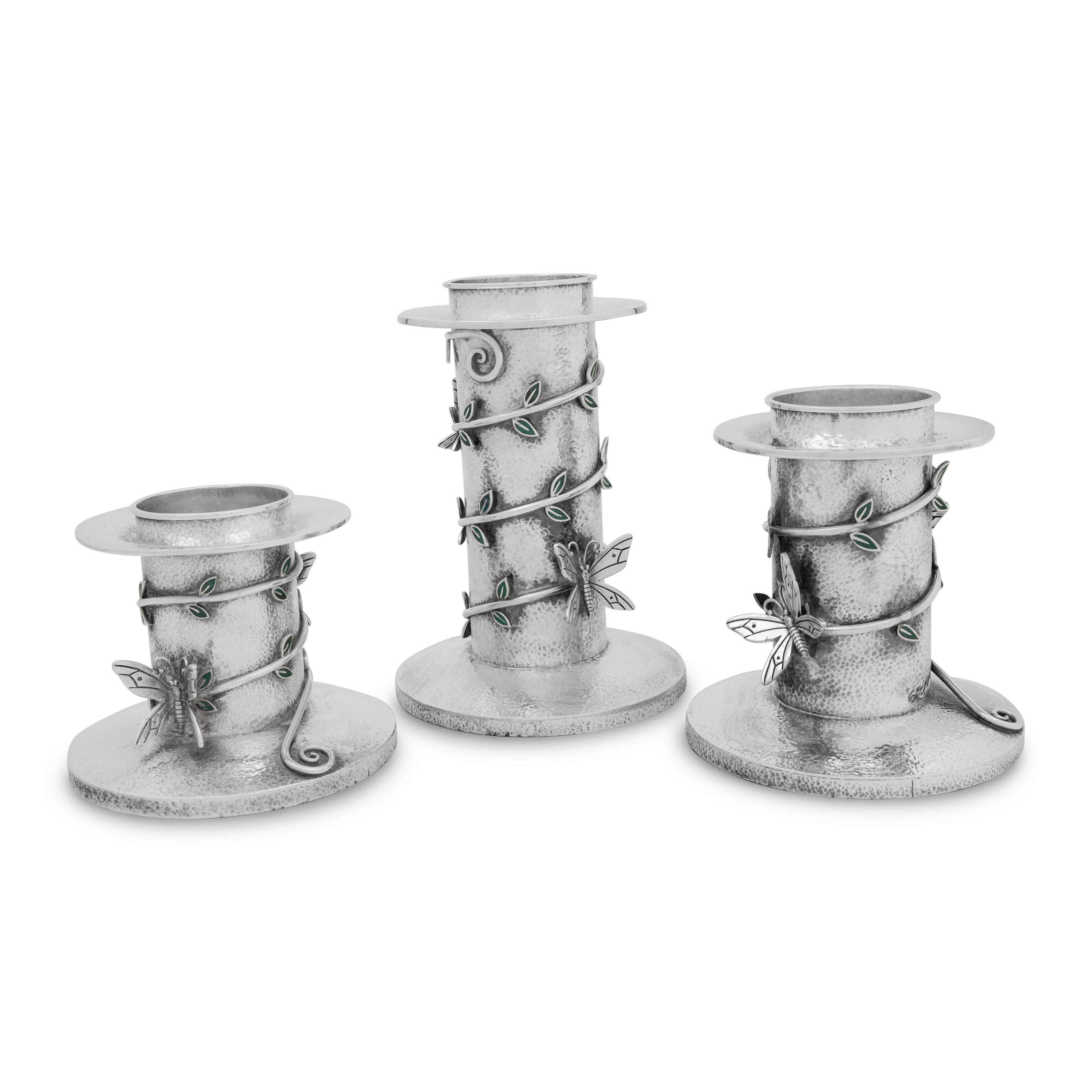 A Set of Three Mexican Silver Graduated Candlesticks