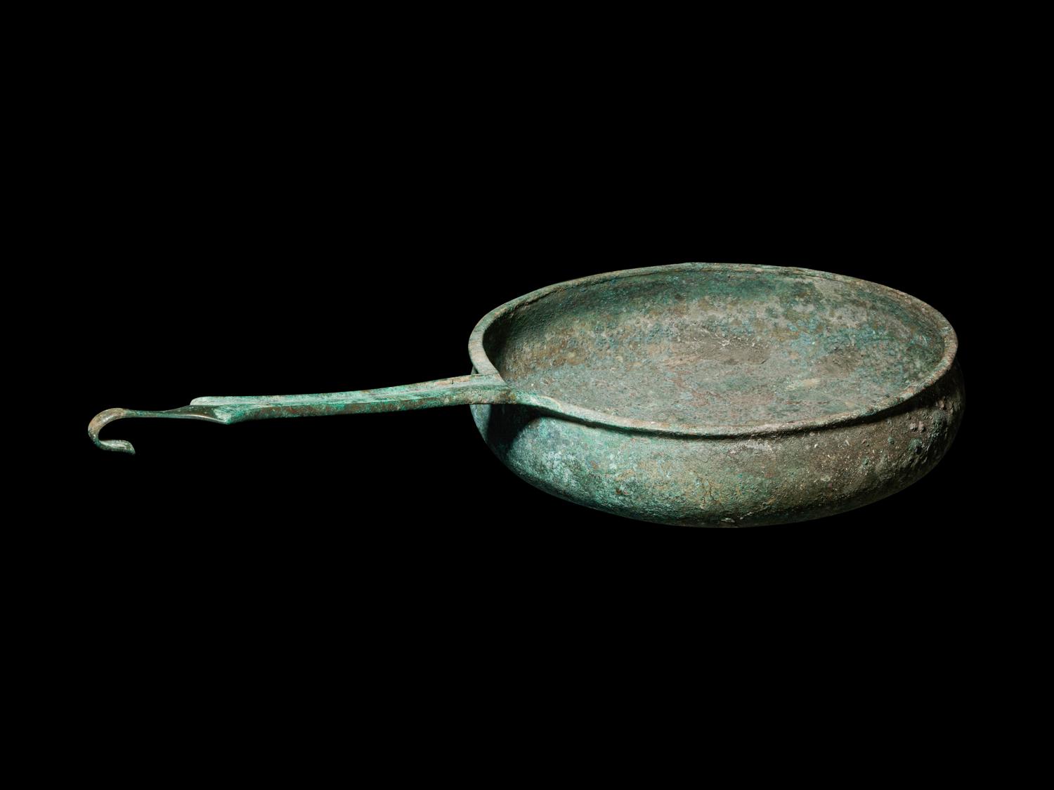A South Italian Bronze Patera with Strap Handle