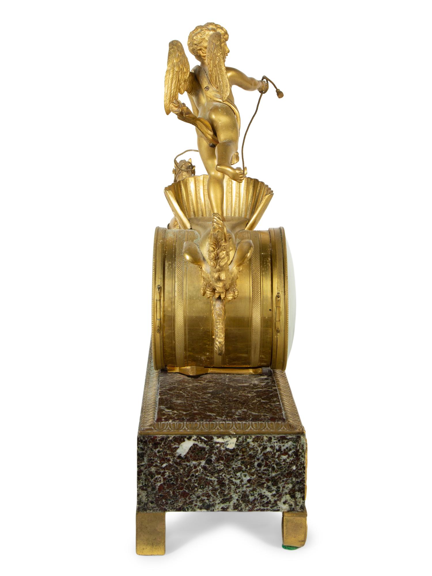 A French Gilt Bronze and Marble Mantel Clock