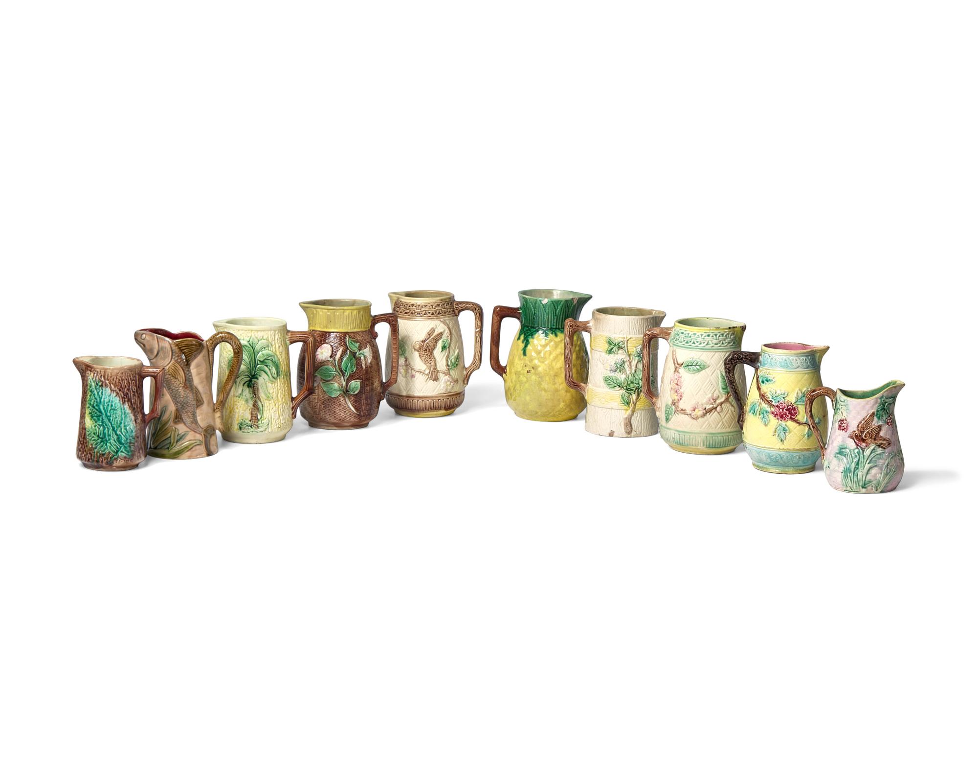 A Collection of Ten Small Majolica Pitchers