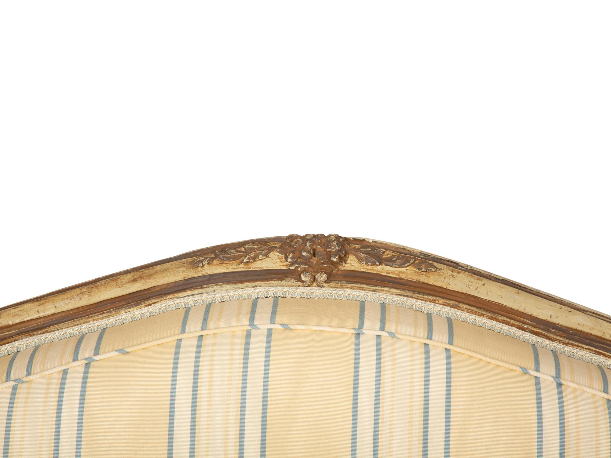 A Pair of Continental Carved and Painted Fauteuils à la Reine