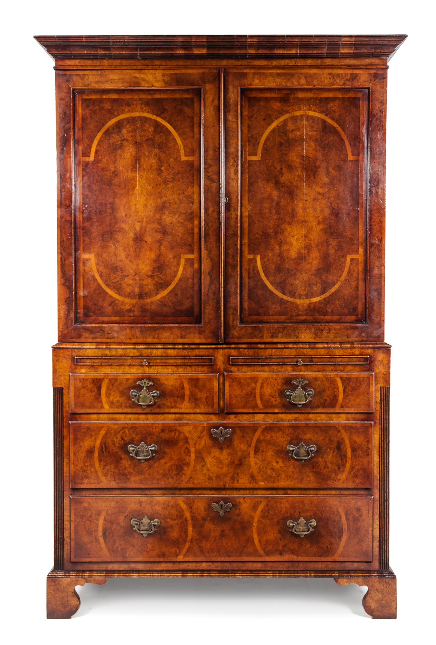A George II Style Burr Walnut Linen Press Height 86 x width 51 x depth 21 inches.