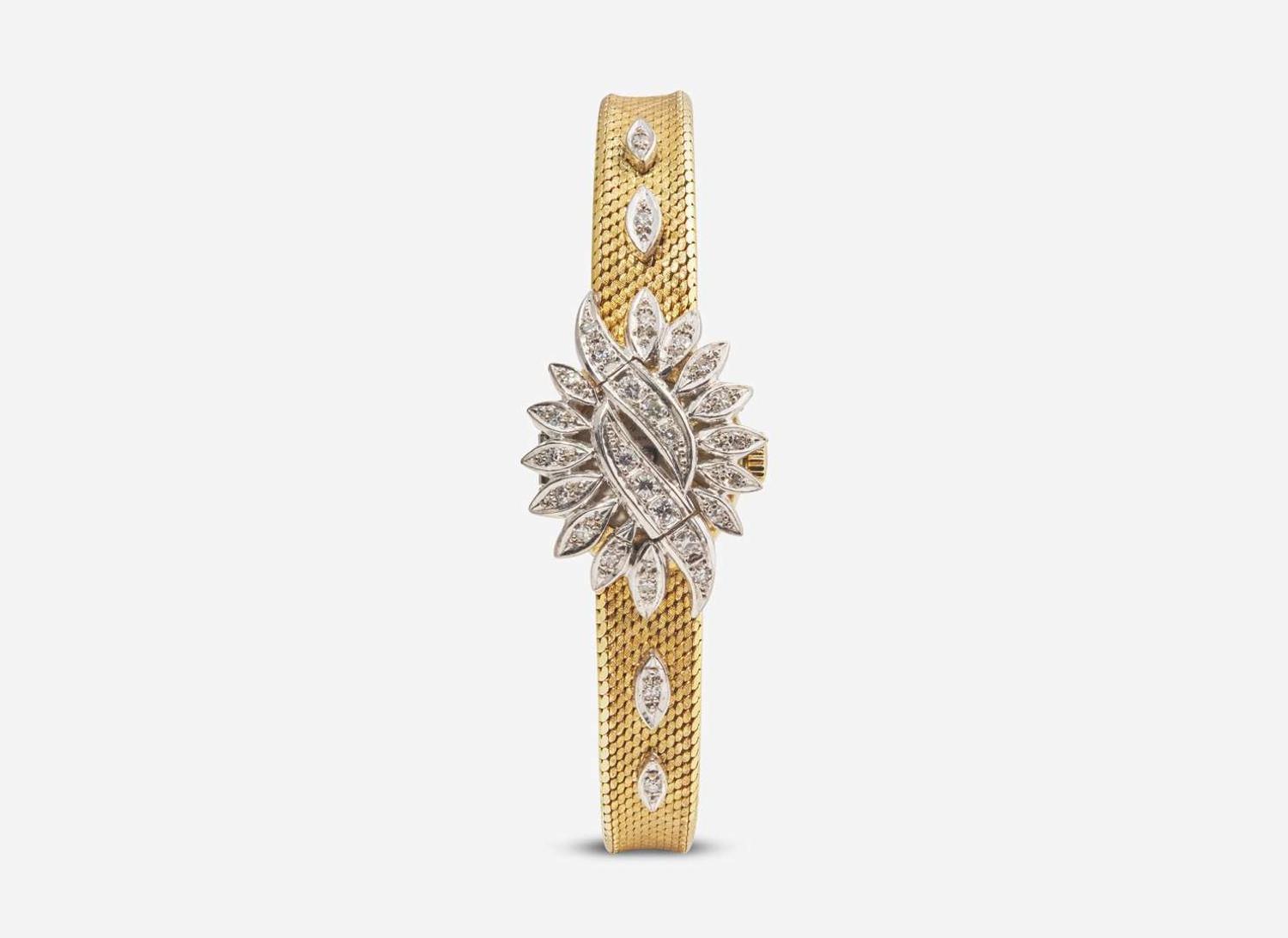 An 18K Yellow Gold and Diamond Hidden Dial Ladies Chopard Watch