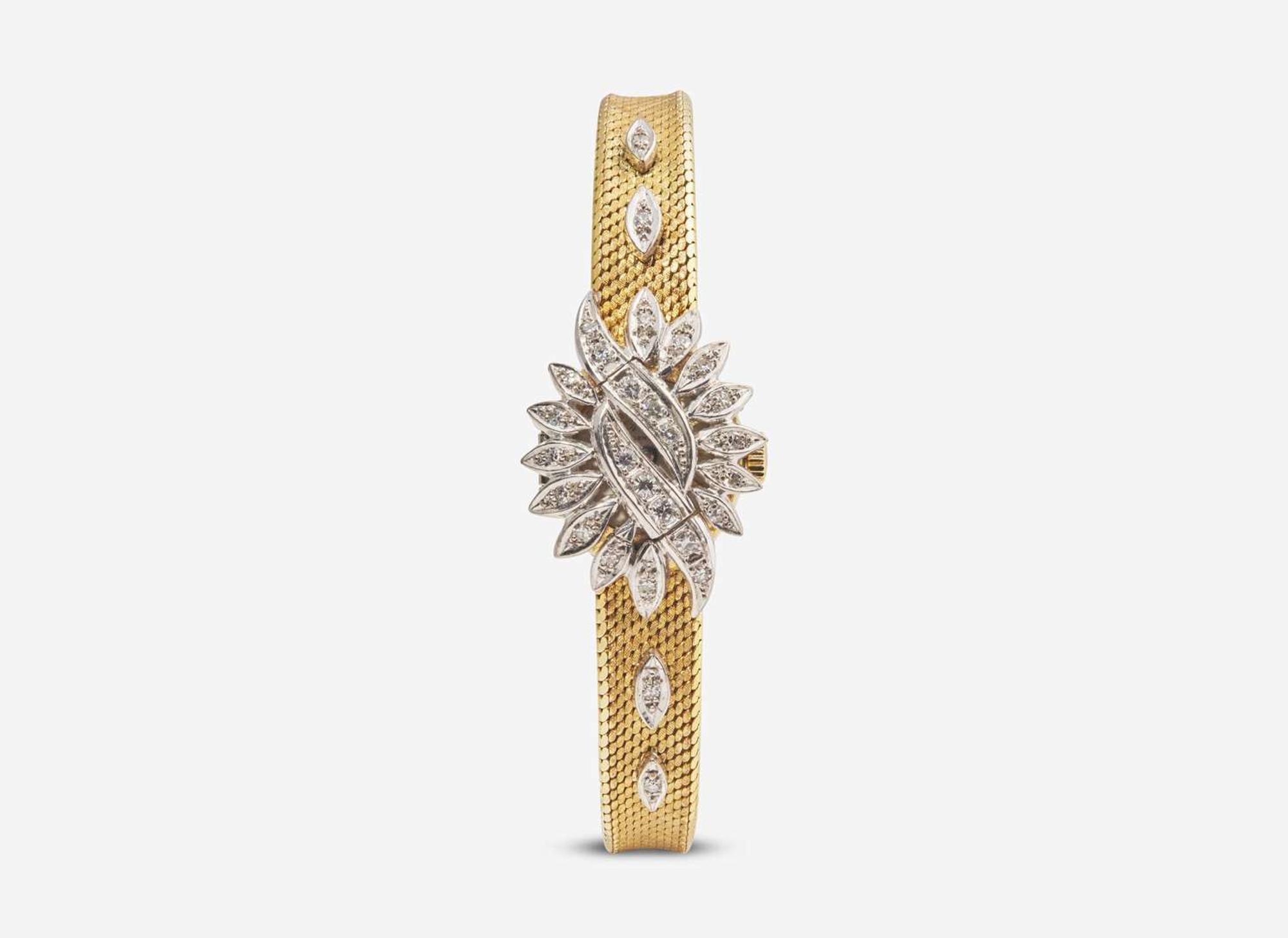 An 18K Yellow Gold and Diamond Hidden Dial Ladies Chopard Watch