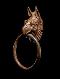 A Greek Bronze Handle with a Griffin Head