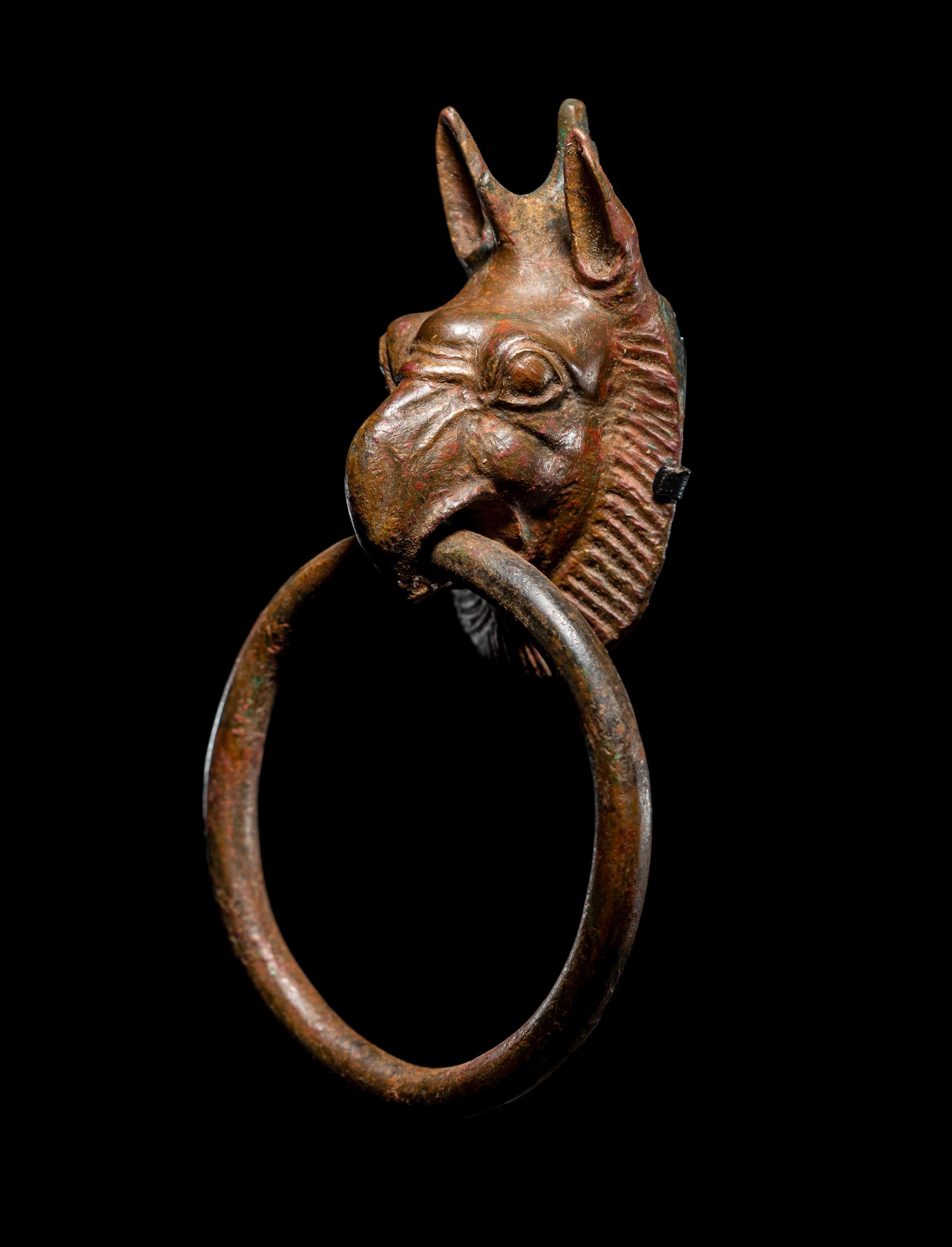 A Greek Bronze Handle with a Griffin Head