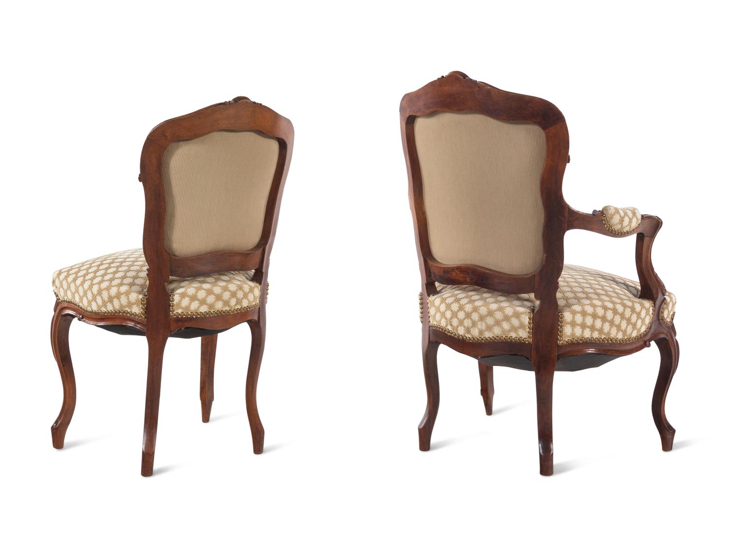A Set of Four Louis XV Style Carved Walnut Chairs