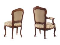 A Set of Four Louis XV Style Carved Walnut Chairs