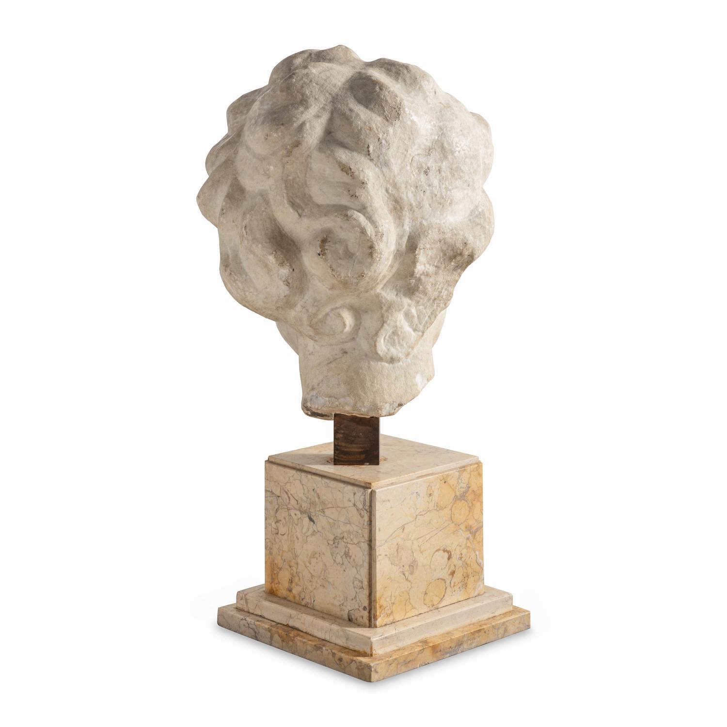 A Large Italian Marble Head of a Putto