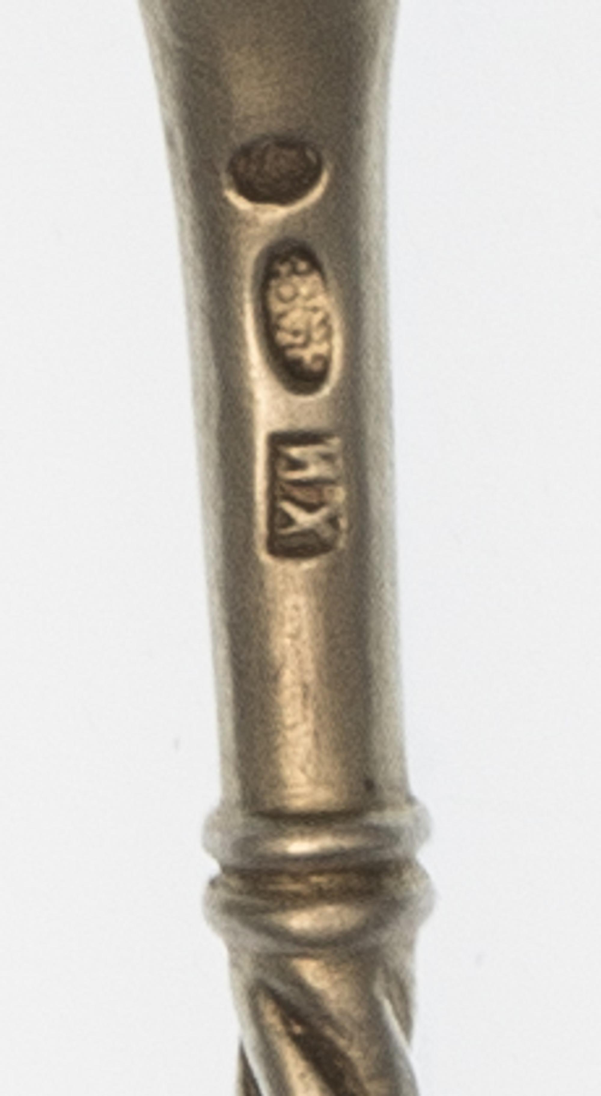 A Russian Silver-Gilt and Enamel Tea Strainer, Maker's mark Cyrillic HKh, having a twist handle and a polychrome enameled terminal, the