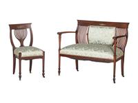 An Edwardian Mahogany Settee and Side Chair
